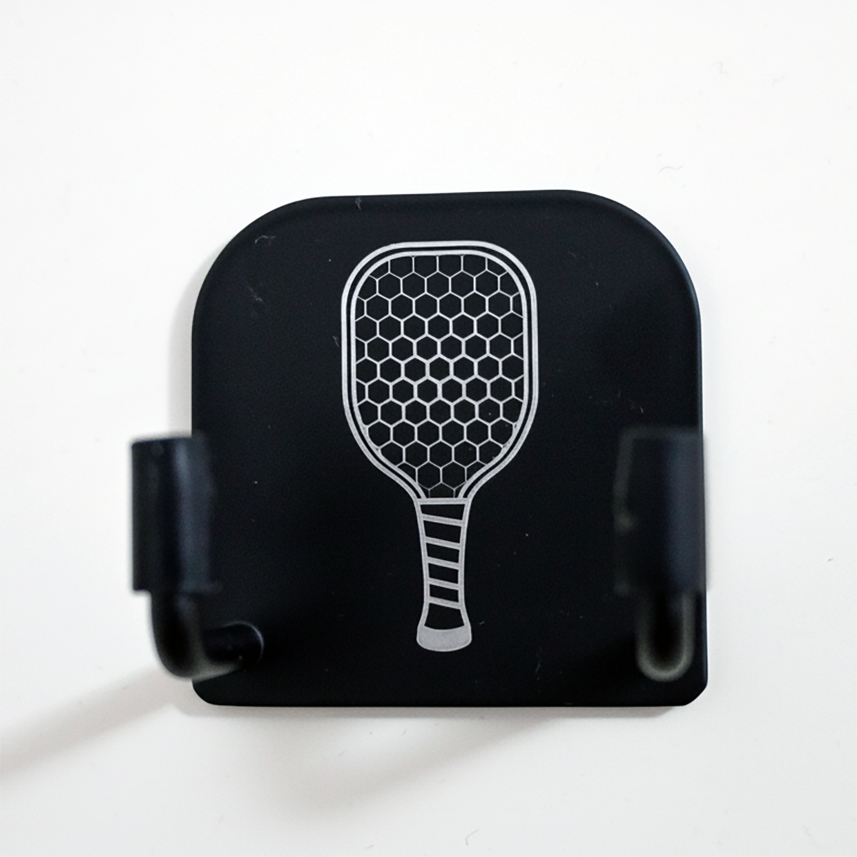 Black case with a white paddle design on a white background