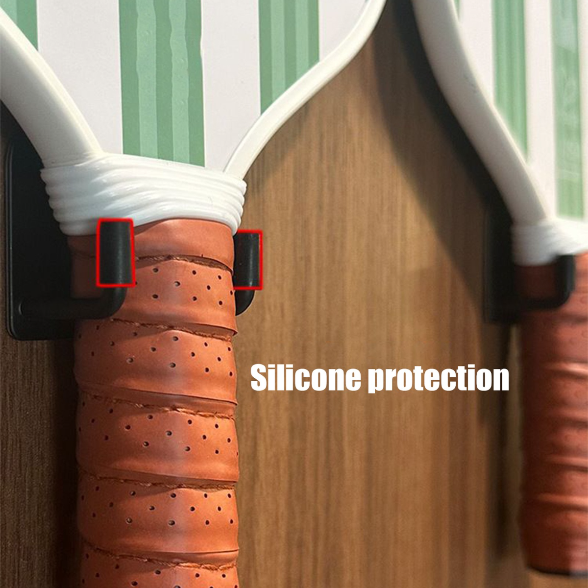 Close-up of a paddle with silicone protection on a wooden surface