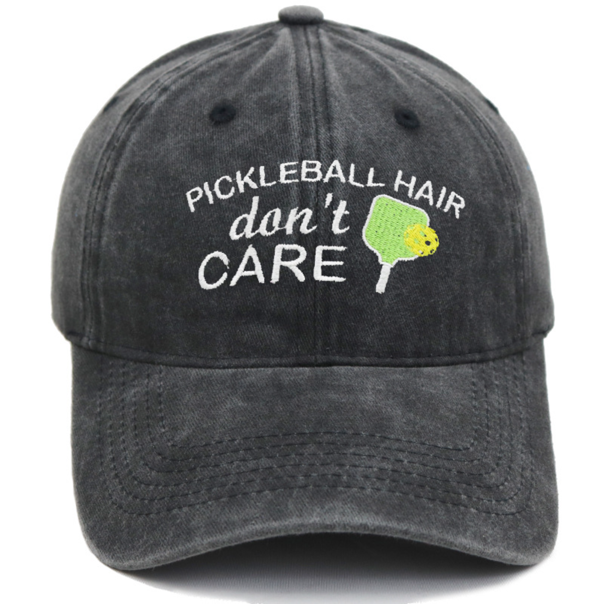 Black cap with 'Pickleball Hair Don't Care' text and pickleball paddle graphic on a white background