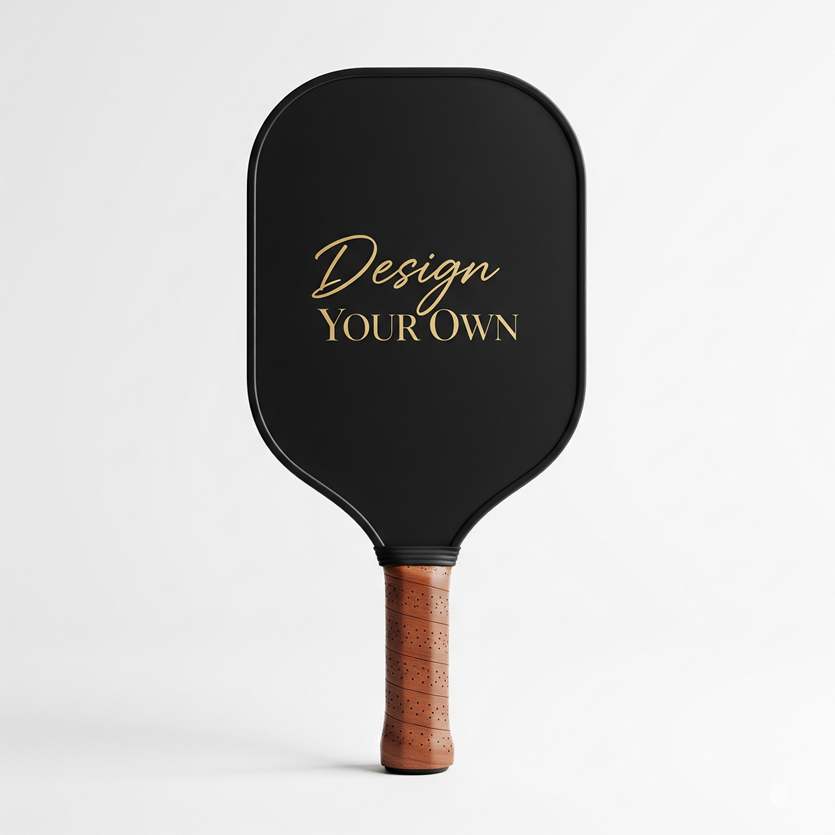 Black pickleball paddle with 'Design Your Own' text and wooden handle on a white background