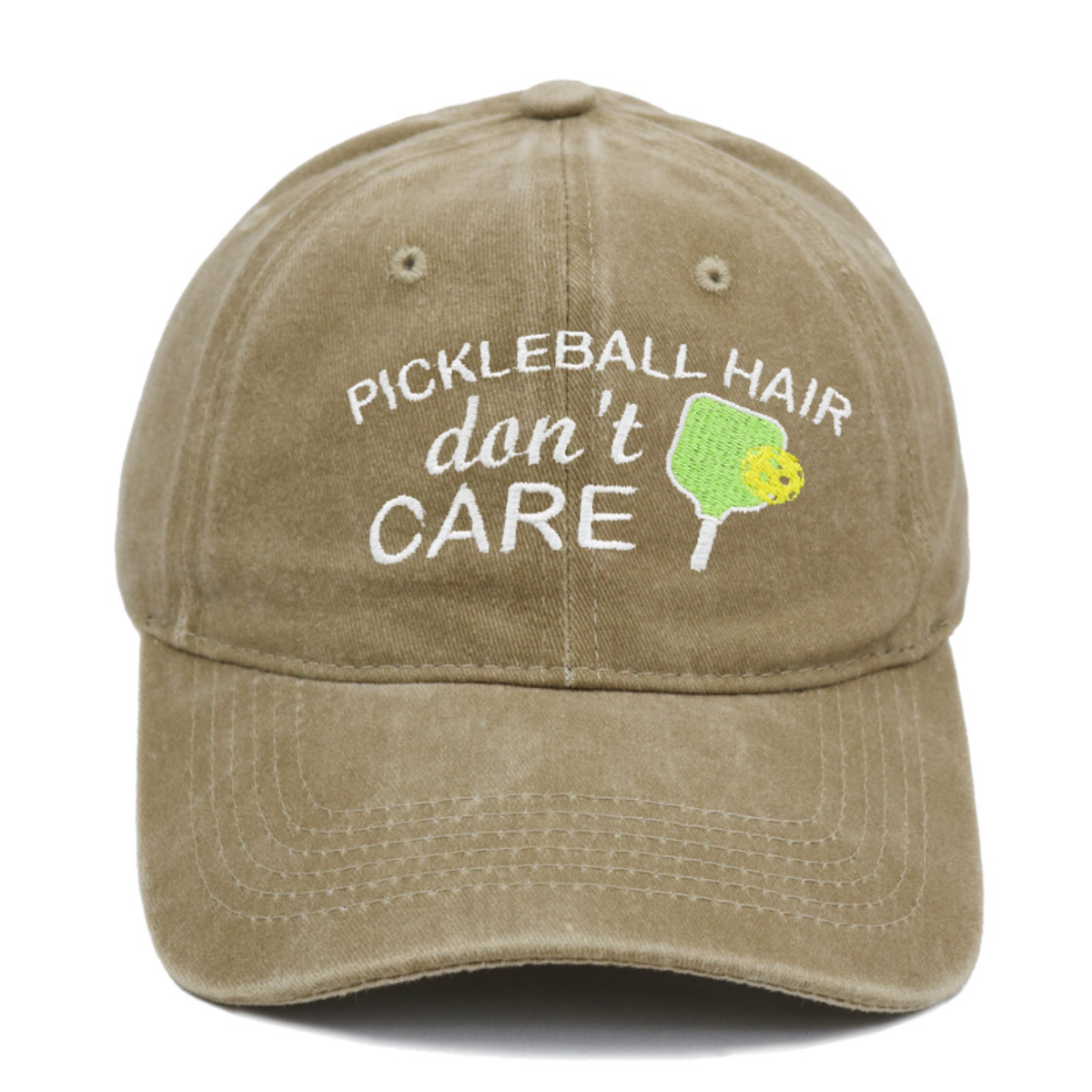 Khaki cap with 'Pickleball Hair don't Care' text and pickleball paddle graphic on a white background