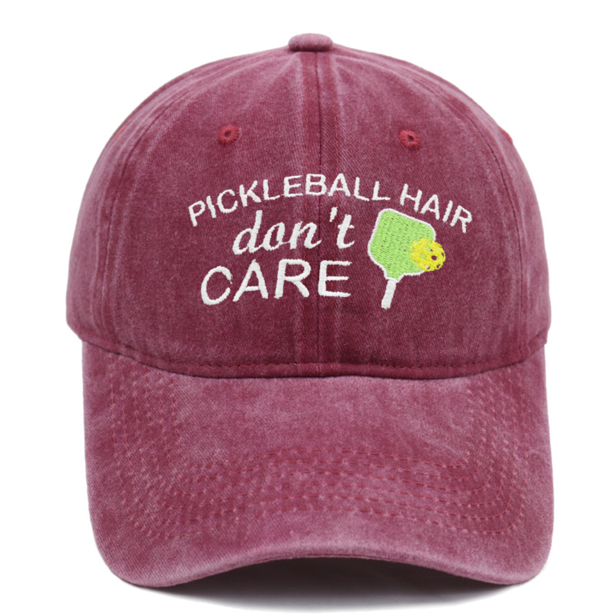 Maroon cap with 'Pickleball Hair don't Care' text and pickle graphic on a white background